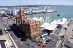 ID 6167 AUCKLAND FERRY BUILDING AND CLOCK TOWER with the ferry terminal (right) and Princes Wharf, the principal cruise ship berth behind. The tiny cruiseship ORION can be seen alongside. 